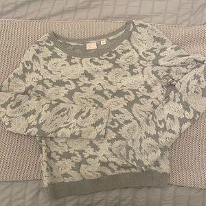 Beautiful gray and white sweater from Anthropologie. Size L. Cropped style.